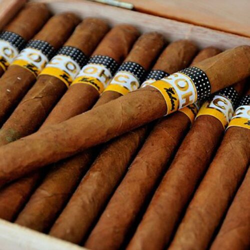 A close up of some cigars in a box