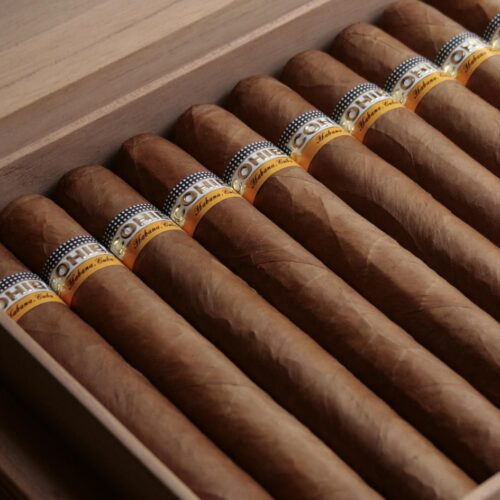 A close up of some cigars in a box