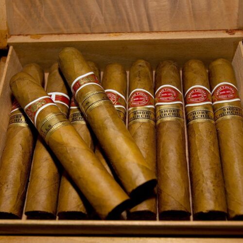 A box of cigars with some of them in it